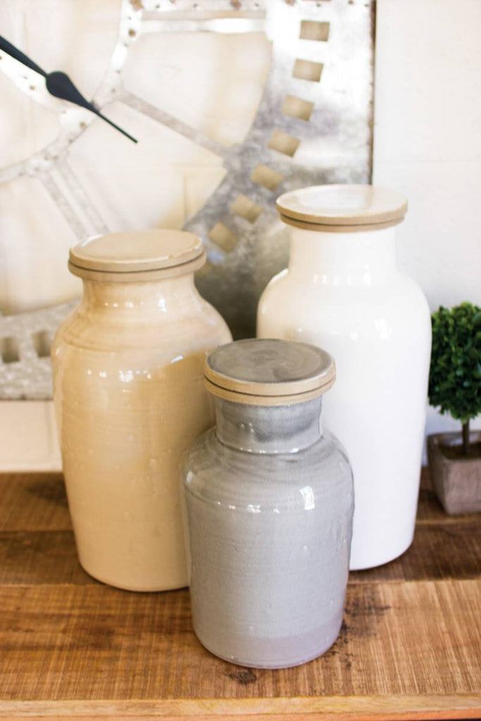 3 ceramic canisters beige gray white different sizes