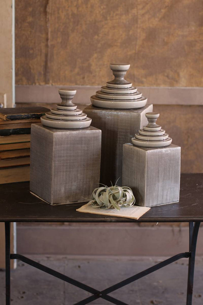 gray ceramic textured canisters with pyramid tops