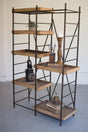 rustic multi-level metal framed scaffold with wood shelves