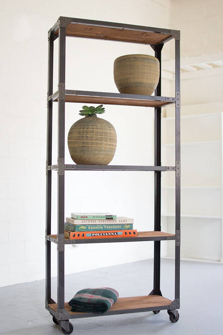 large iron frame recycled wood shelving unit on wheels