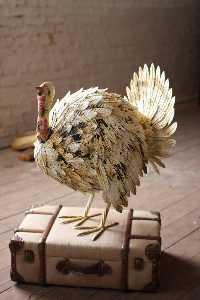 white painted metal turkey with voluminous feathers