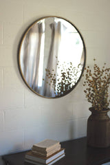 round brass framed mirror