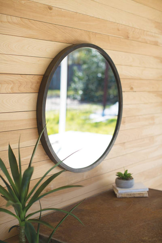 round wall mirror with natural metal frame
