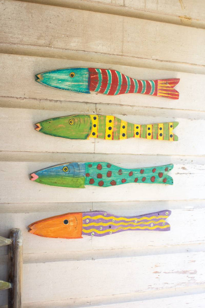 three painted wood fish wall art