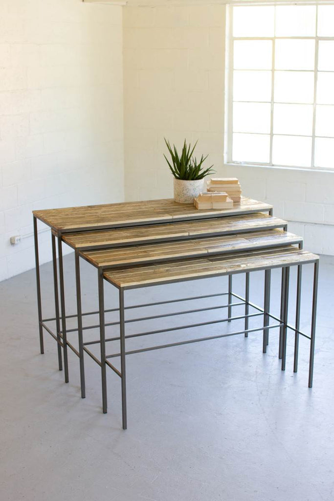 four nested standing shelves of iron frame and wood tops