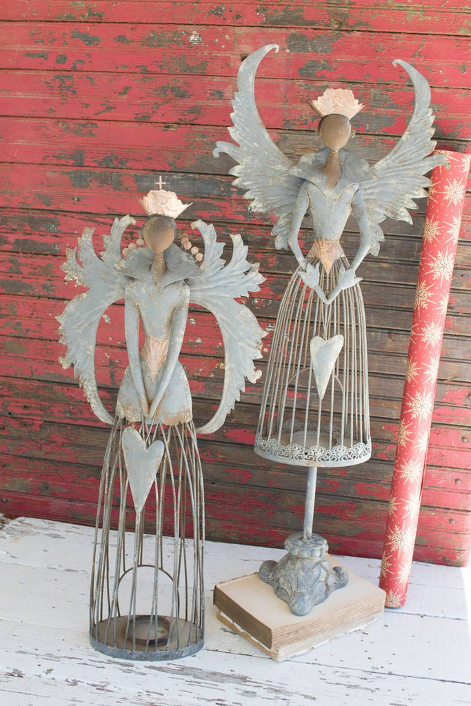 2 metal christmas angels with tea light holder at bottom