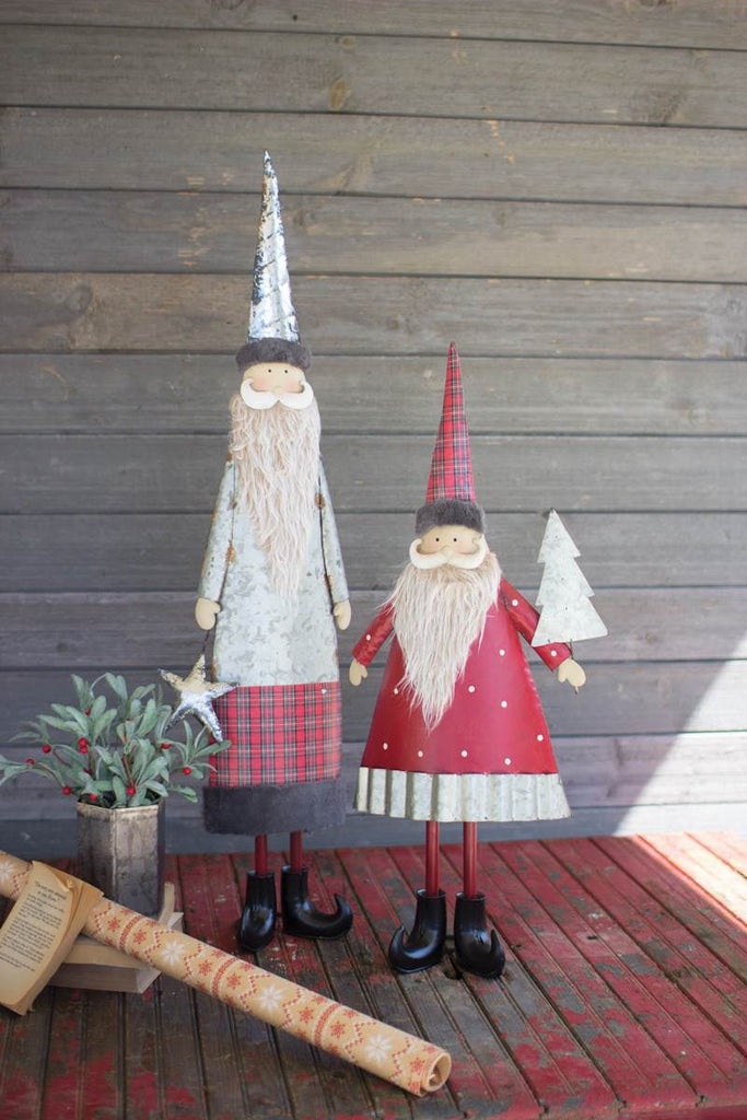 two metal santas with beards - one tall one short
