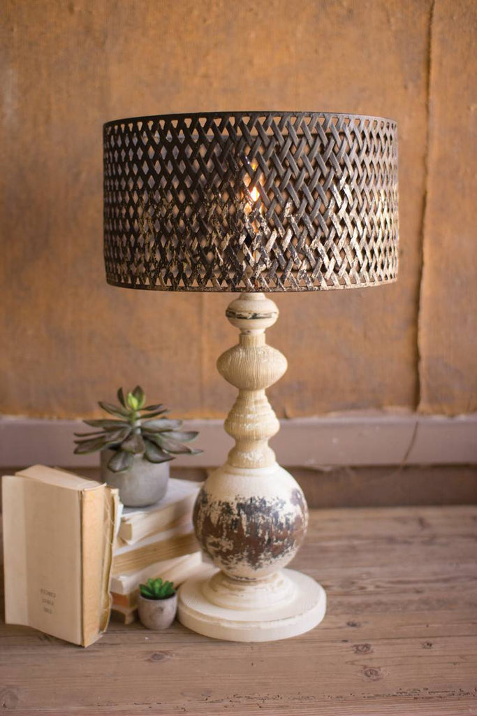 table lamp with round metal base and perforated shade