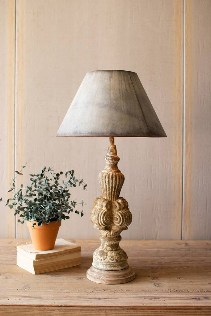 table lamp with sculpted base and galvanized lamp shade