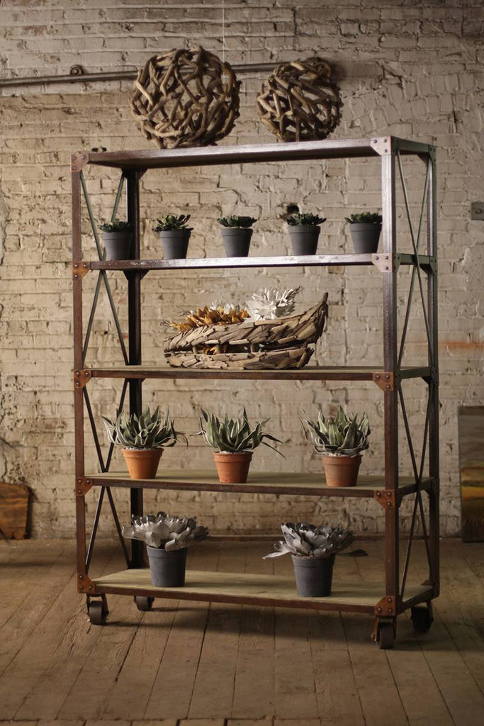 tall iron shelving unit with five wood shelves on iron casters