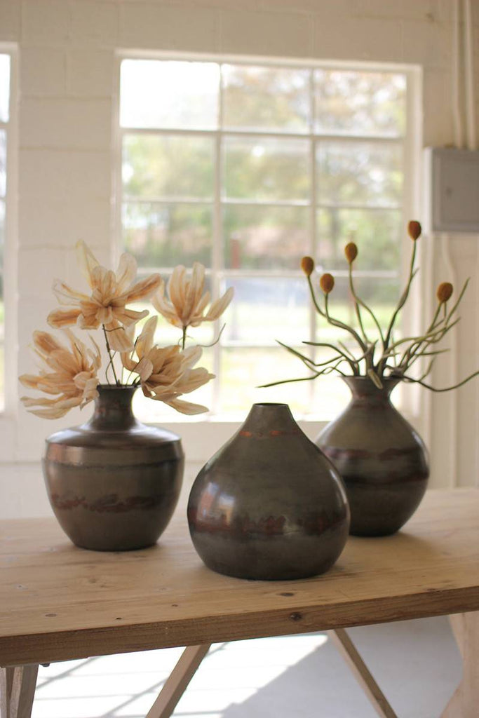 raw metal vases with copper detail