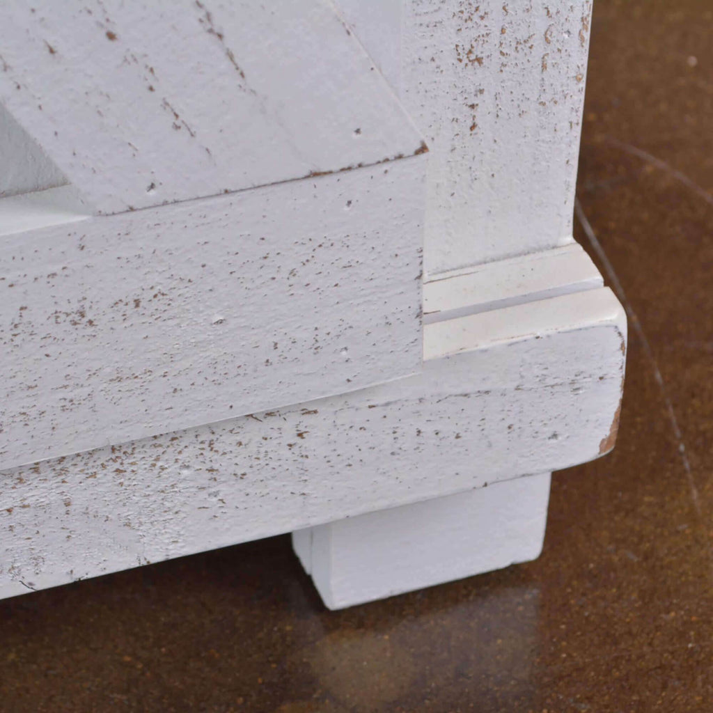 white barn door console cabinet - corner foot close-up