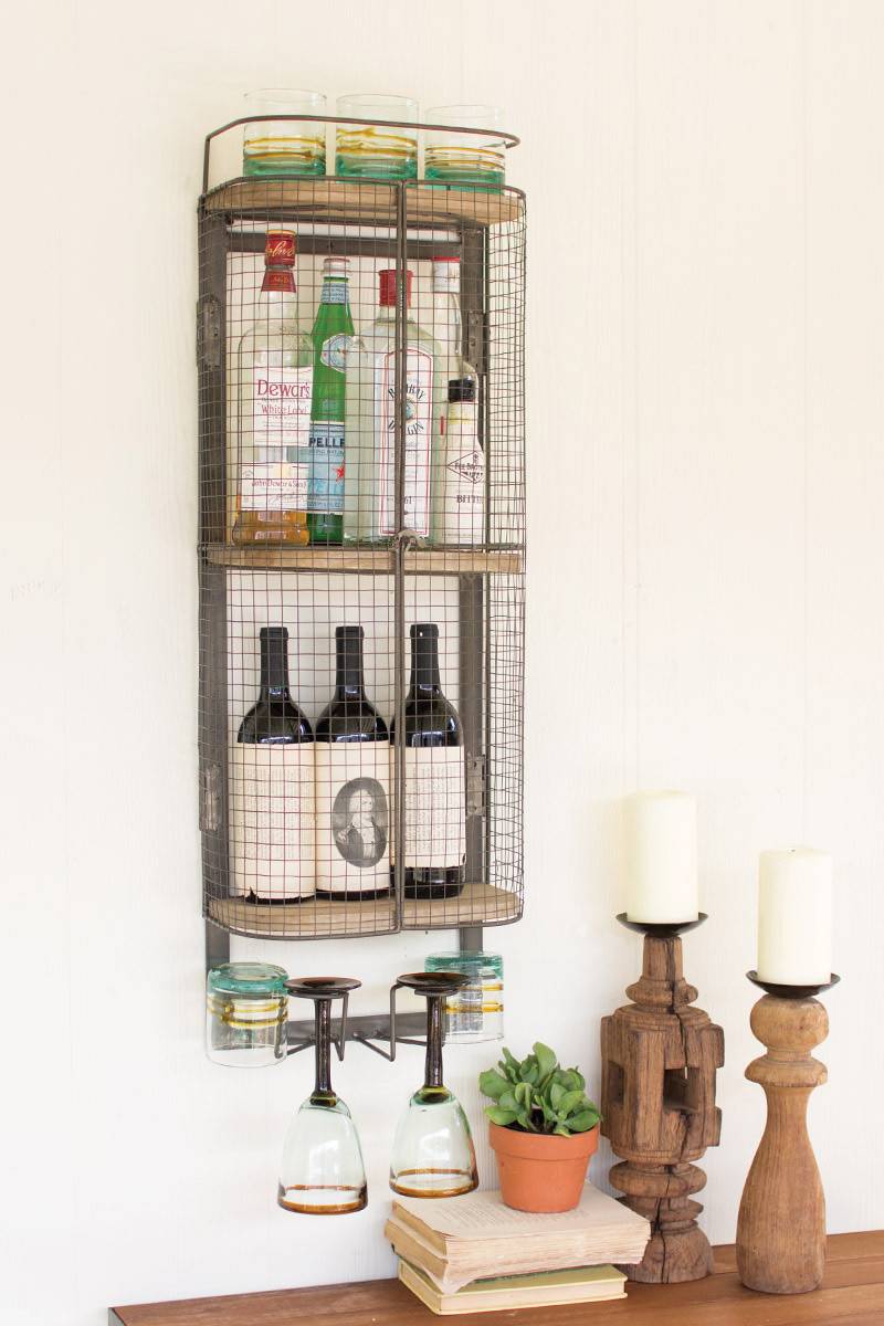 minibar showing various bottles of liquor and hanging glasses