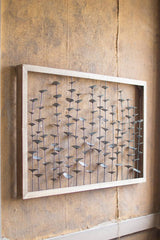 metal leaves on stems wall art framed in wood